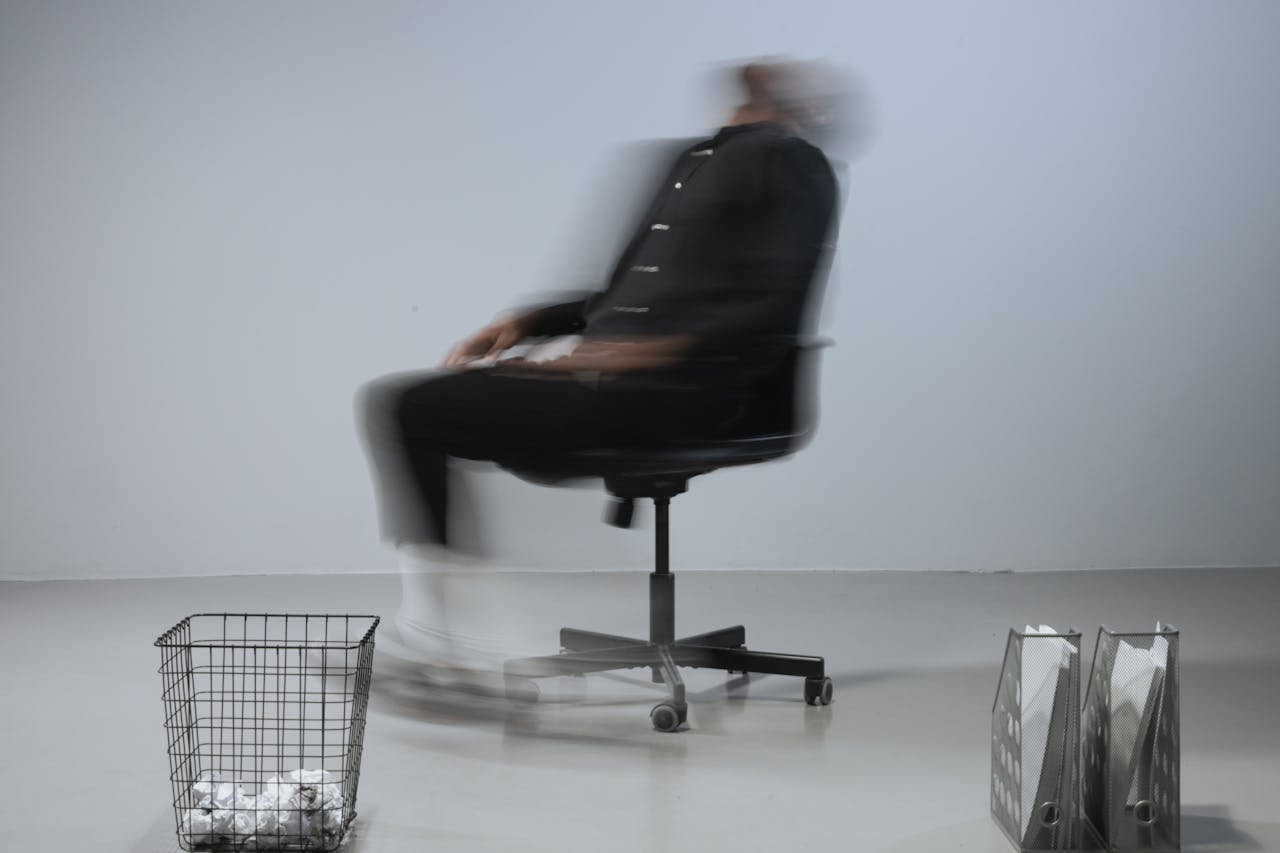 Dynamic blurred image depicting stress in a modern office setting.